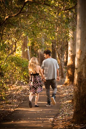 Spend time together and explore the National Park couples walking in the rainforest
